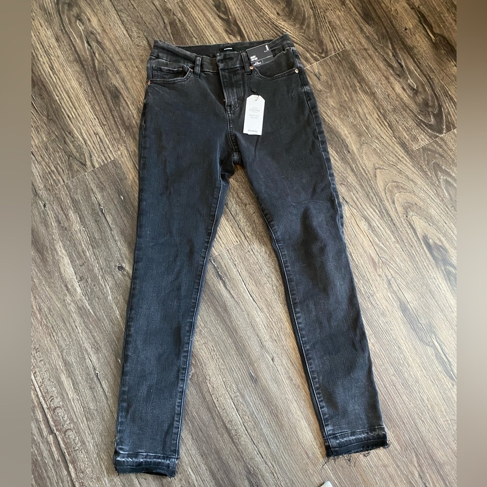 Mid rise black raw drop hem Flexx skinny jeans